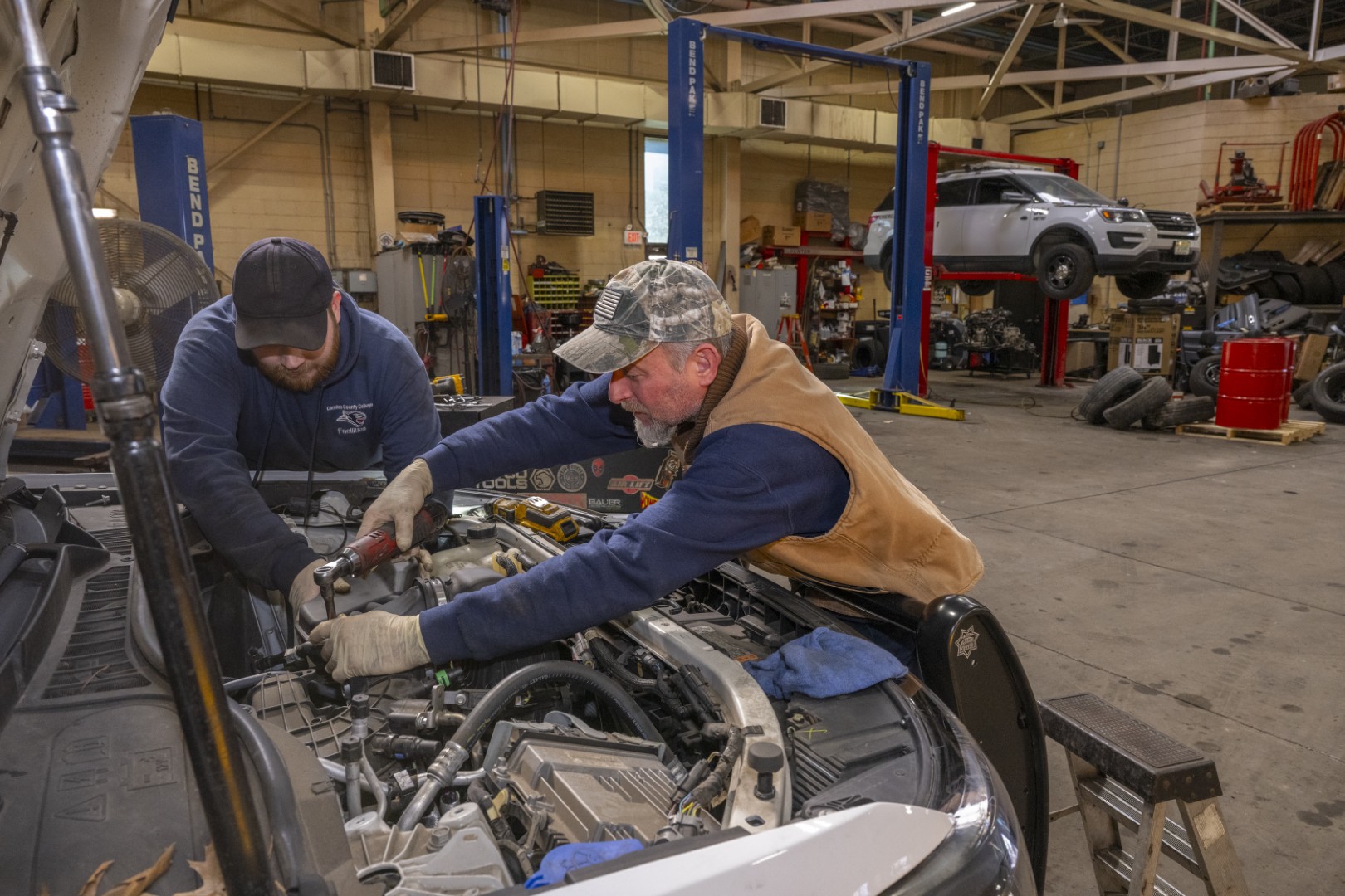 CCMUA maintenance technicians repairing wastewater treatment equipment in Camden County facility workshop